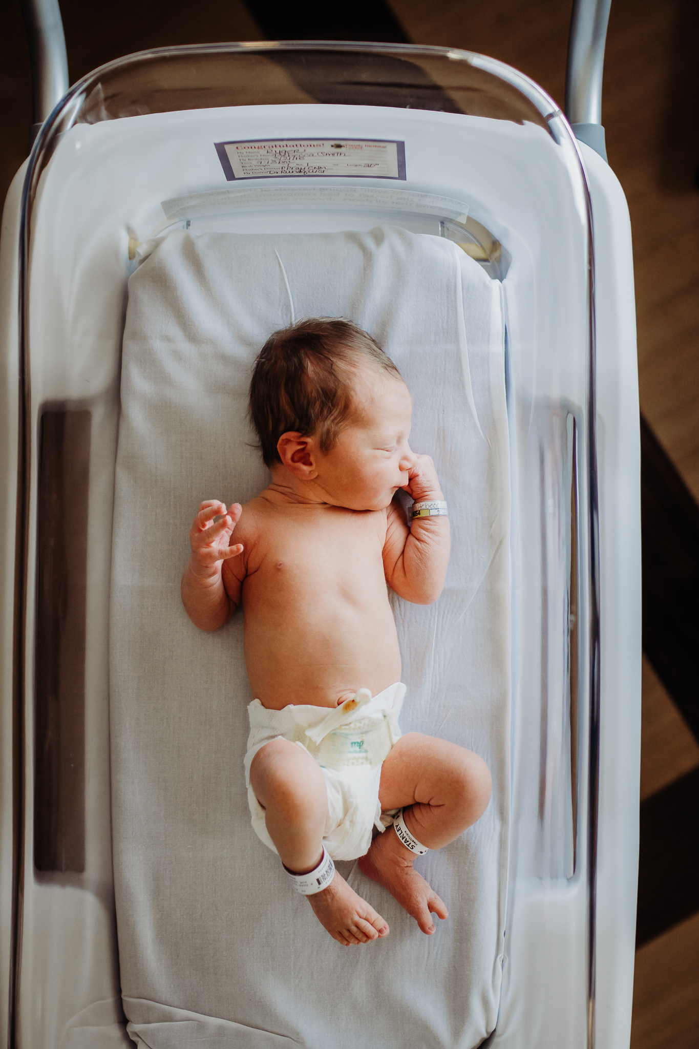 baby photographer, baby photographer, newborn, newborn photographer in lawrence kansas, lawrence, ks, lawrence memorial hospital, lifestyle newborn, kayla kohn, natural posing, bassinet, lawrence ks, newborn photographer, best newborn photographer, natural posing newborn